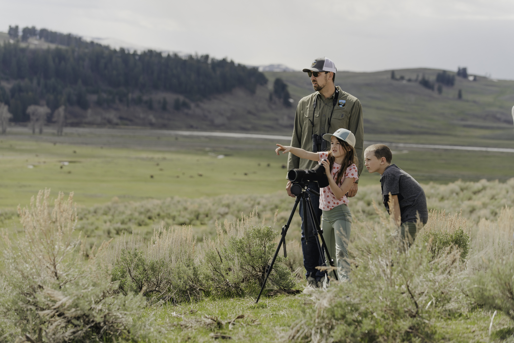 Joey Caesar, lead naturalist and head of operations, scouting for the Big 13 in the Teton ecosystem